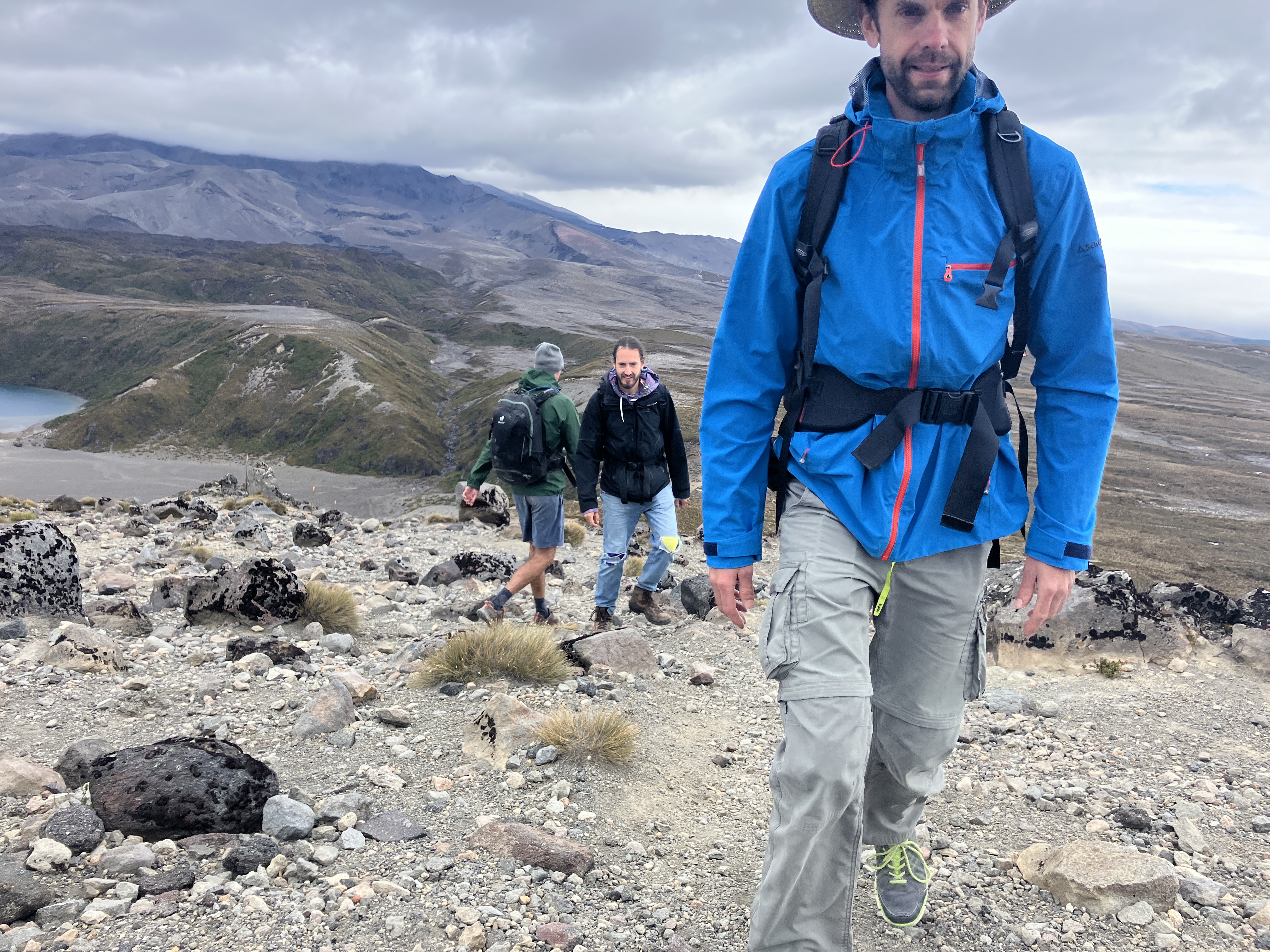 Group of men hiking on a mountain landscape